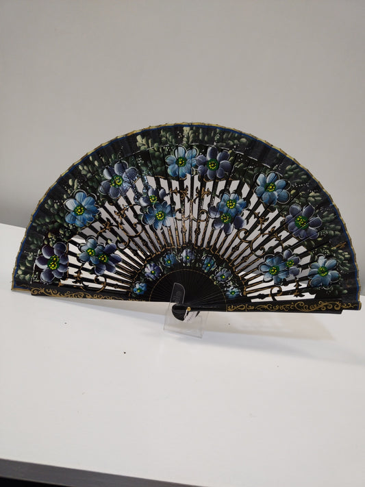 Carved and black lacquered fan with blue flowers.