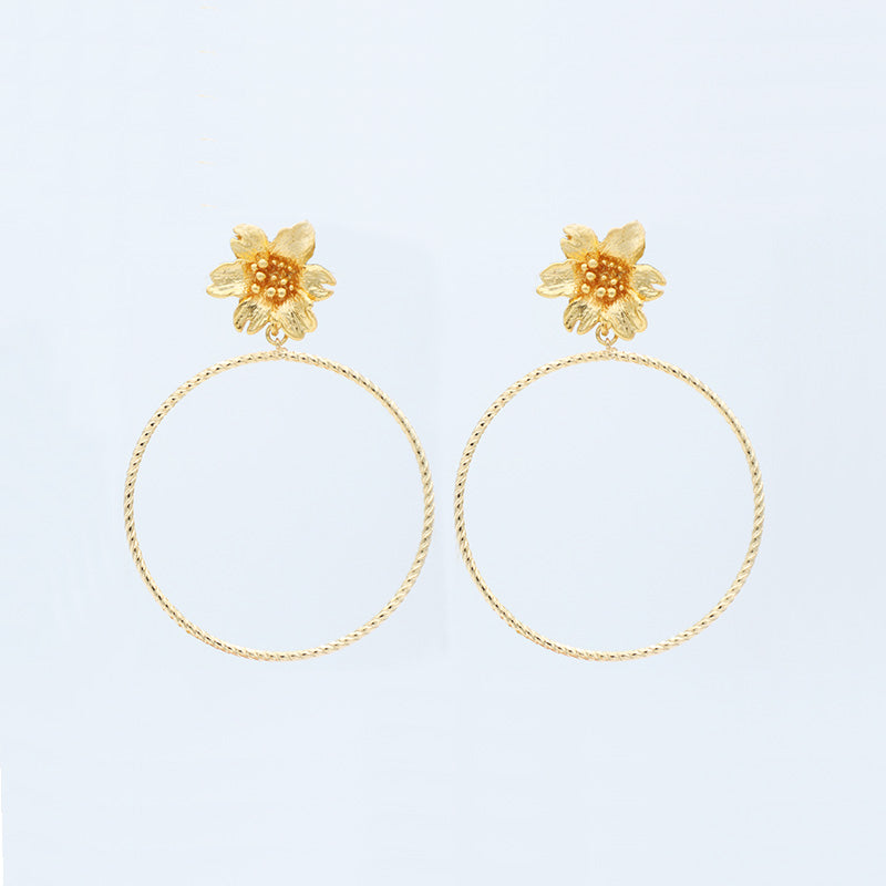 Gold braided flower grip earrings